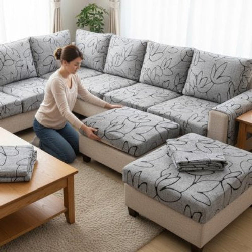 housse canapé d'angle aux motifs florales gris et noir sur un sofa à plusieurs places
