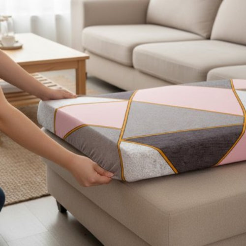 housse canapé d'angle aux motifs géométriques rose et gris sur un coussin de canapé