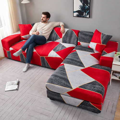 housse canape d'angle avec triangles rouges et gris et un homme assis relaxant