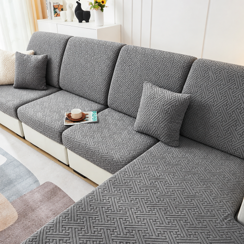 housse de canape d angle gris au design romain dans un salon aux murs blancs