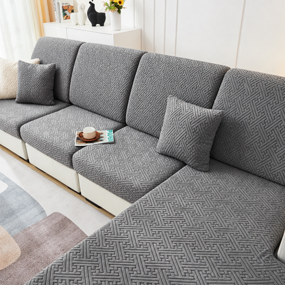housse de canape d angle gris au design romain dans un salon aux murs blancs